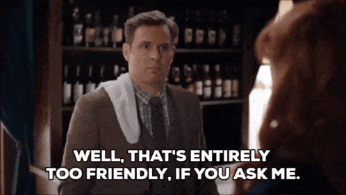 a man in a suit and tie is talking to a woman and says well that 's entirely too friendly if you ask me