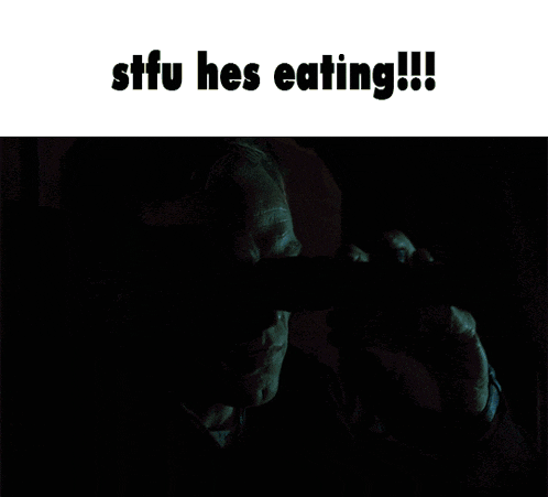 a man eating a pizza in a car with the words stfu hes eating