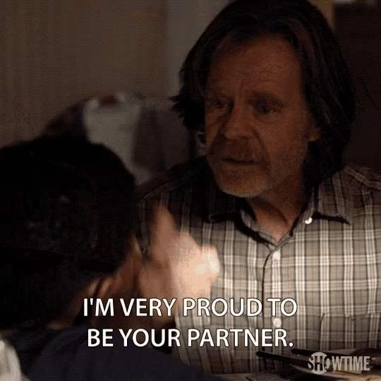 a man says " i 'm very proud to be your partner " in front of a woman