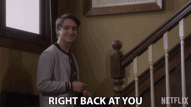 a man standing on a set of stairs with the words right back at you written below him