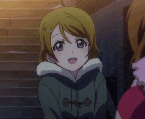 a girl with green hair and purple eyes is wearing a hooded jacket