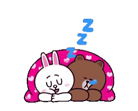 a cartoon character is laying on its back on a pink blanket .