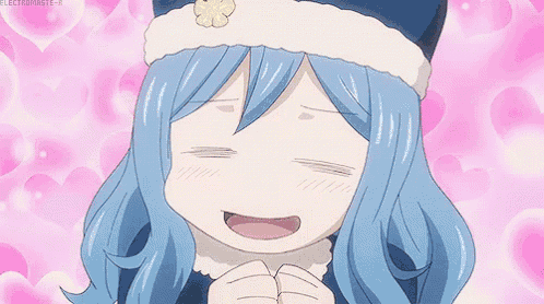 a girl with blue hair is wearing a hat and smiling .