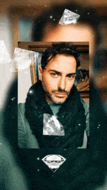 a man with a scarf around his neck and a diamond in front of his face