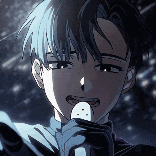 a boy with blue hair is holding a microphone in his hand