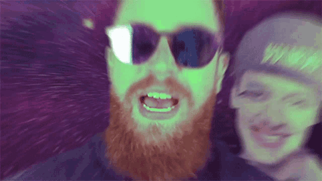 a man with a beard is wearing sunglasses and a hat with the word nike on it