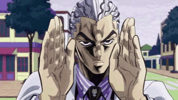 a man in a suit and tie is making a funny face with his hands in front of his face .