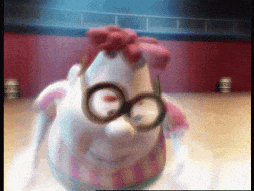 a close up of a cartoon character wearing glasses and a pink shirt