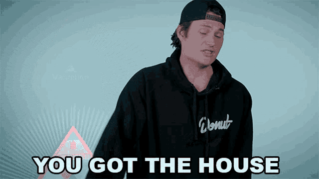a man wearing a black donut hoodie says you got the house