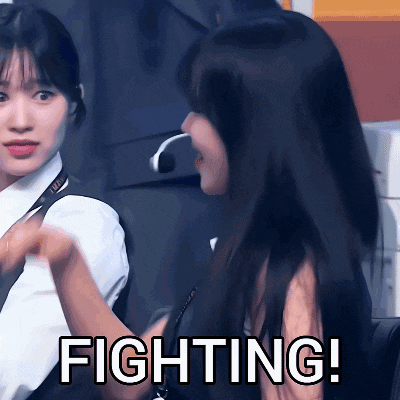 two women are standing next to each other and the words fighting are visible