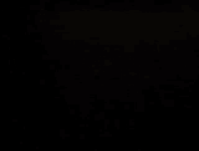 a pair of glowing purple eyes on a black background