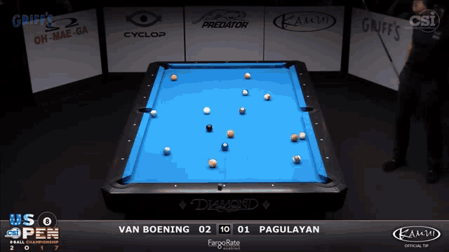 a pool table with a blue cloth and a diamond logo on it