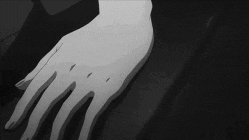 a black and white photo of a person 's hand with a few holes in it .