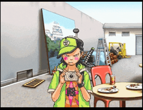 a boy in a green hat is holding a camera in front of a large painting