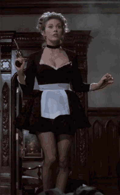 a woman in a maid costume holds a gun in her hand
