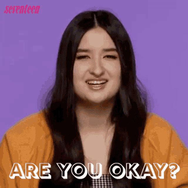 a woman is smiling with the words are you okay in front of her