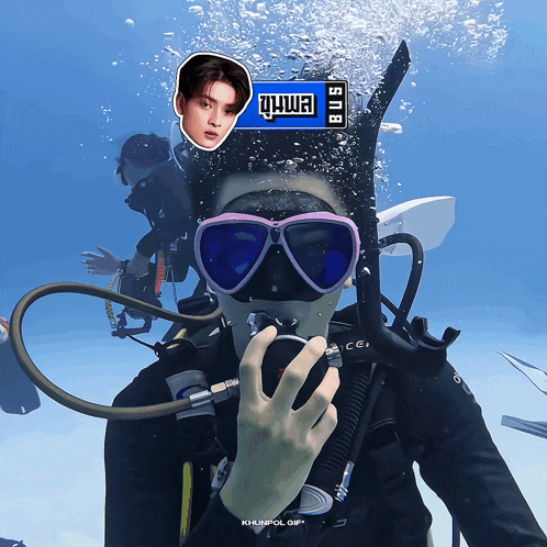 a scuba diver has a sticker on his face that says ' sn9 '