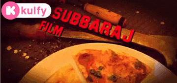 a slice of pizza on a plate next to a knife and a sign that says kulfy film