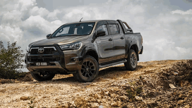 a toyota hilux truck with a license plate that says ves 8398