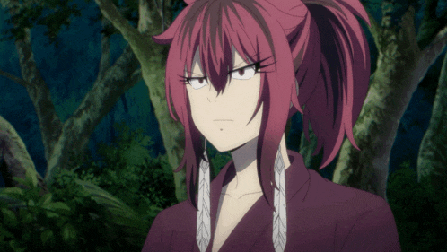 a girl with red hair and a ponytail is standing in the woods