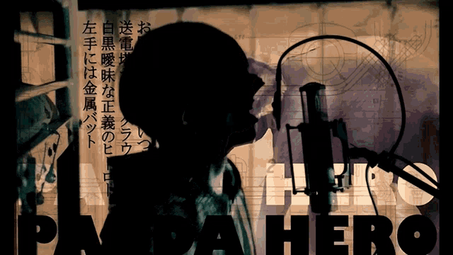 a silhouette of a man singing into a microphone with the words para hero in the corner
