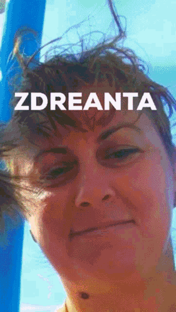 a close up of a woman 's face with the word zdreanta on the top