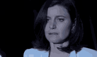 a woman says " fuck it " in front of a dark background