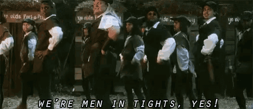 a group of men are standing in a line with the words we 're men in tights