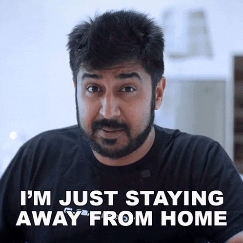 a man with a beard and a black shirt says i 'm just staying away from home