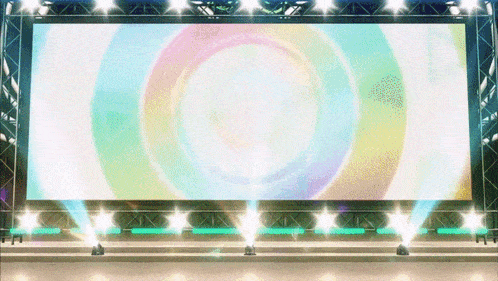 a large screen with a rainbow colored circle in the middle of it
