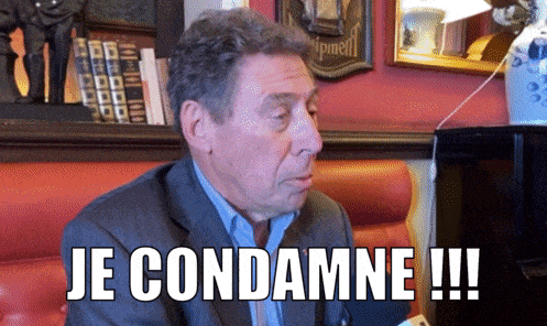 a man in a suit says je condamne !!! in a restaurant