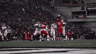 a football game is being played in a stadium with a sign that says toyota