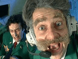 a man with a beard and headphones is making a funny face while another man looks on .
