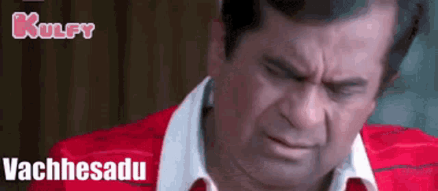 a man in a red shirt and white collar is making a funny face with the words vachhesadu written below him