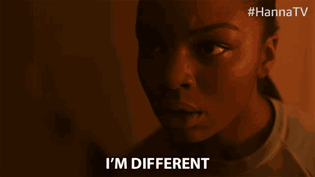 a close up of a woman 's face with the words i 'm different