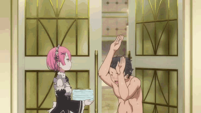 a girl with pink hair is holding a stack of towels next to a man without a shirt
