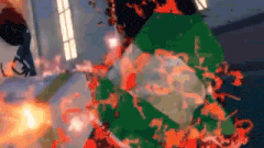 a person is standing in front of a christmas tree that is on fire