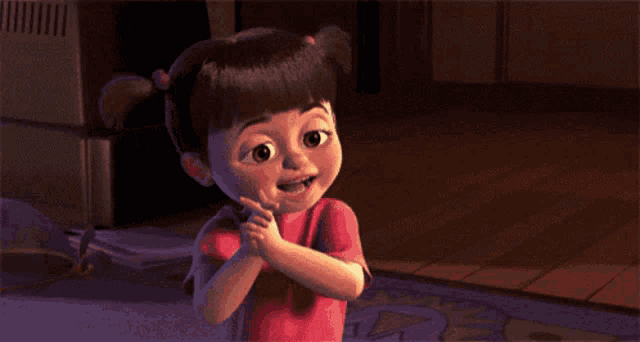 boo from monsters inc is smiling and clapping
