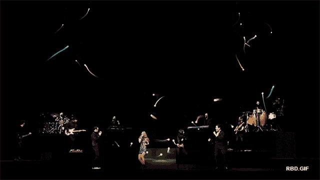 a group of people on a stage with rbd.gif written on the bottom right