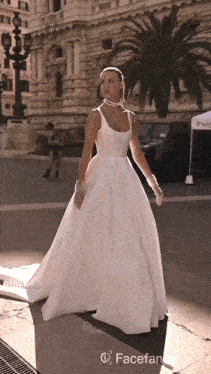 a woman in a white dress with facefancy on the bottom left