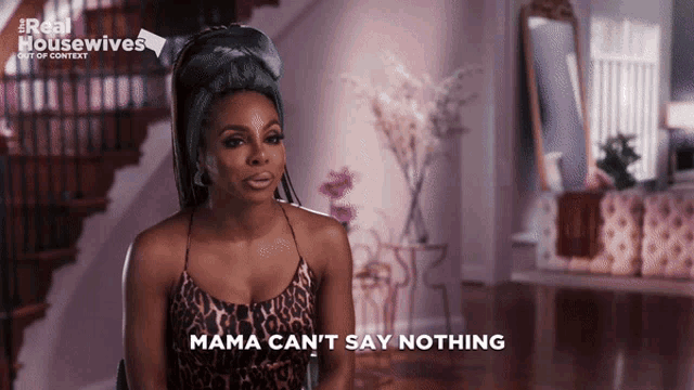 a woman says mama can 't say nothing in a leopard print dress
