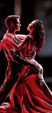 a man and woman are dancing in front of a sign that says vct