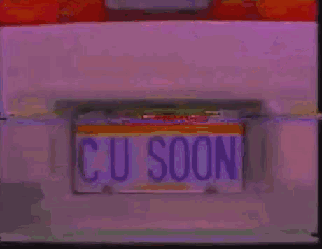 a white car has a license plate that says cu soon