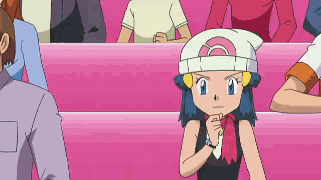 a girl wearing a hat with a pink circle on it