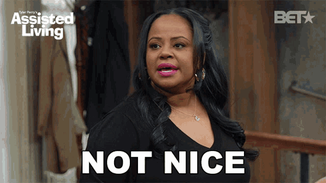 a woman in a black shirt says not nice in front of a bet logo