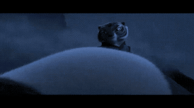 a cartoon tiger is standing on top of a white blanket