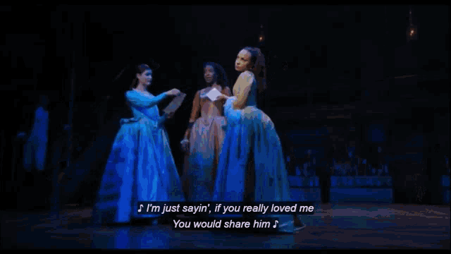 three women are singing on a stage and one of them is saying i 'm just sayin ' if you really loved me
