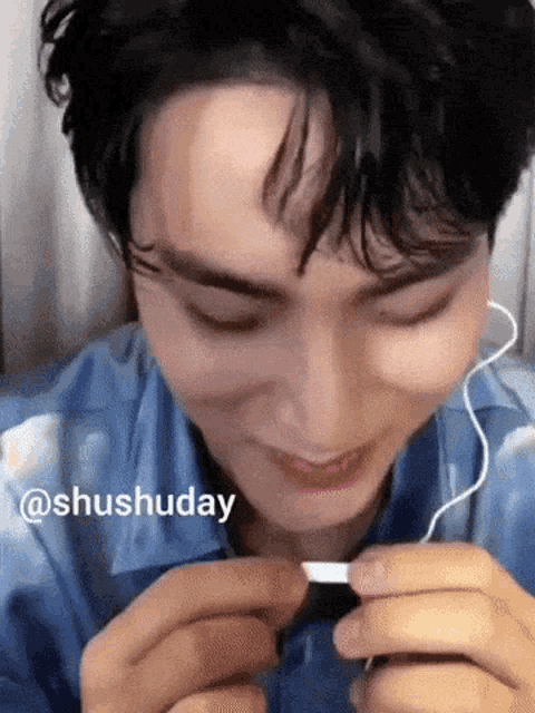 a close up of a person 's face with the words shushuday written on the bottom