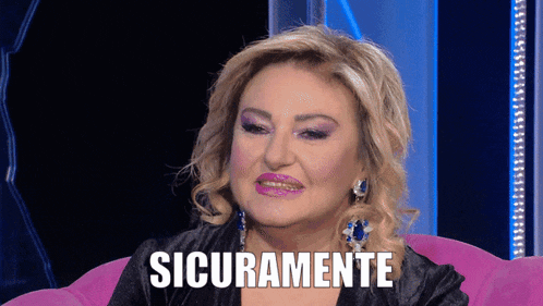 a woman is sitting on a pink couch with the words sicuramente written on her face