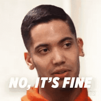 a close up of a man 's face with the words `` no , it 's fine '' written on it .